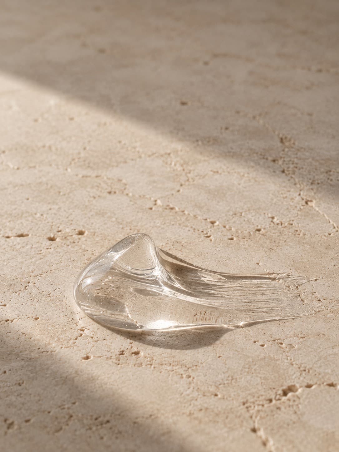 Clear gel on a pale stone surface